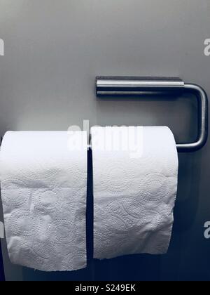 Silver toilet roll holder with two toilet rolls on it Stock Photo