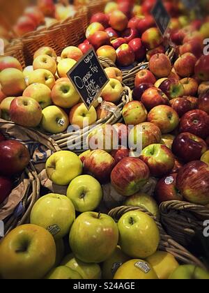 Bushel baskets of fresh apples on sale at Green grocer, United States Stock Photo