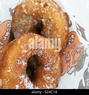 Two fresh doughnuts in a paper bag Stock Photo
