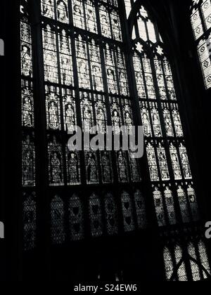 Huge stained glass window in Gloucester gothic cathedral, part of the cathedral was used in Harry Potter. Stock Photo