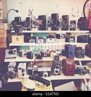old cameras on a shelf of a street market Stock Photo
