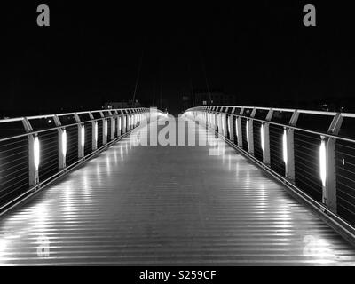 Pedestrian bridge across the River Usk at night, Newport, South Wales. Stock Photo