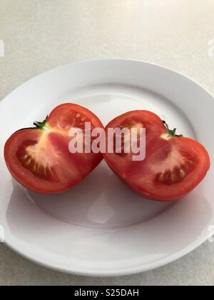 Red tomato cut in half Stock Photo