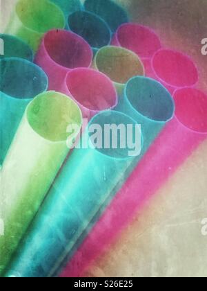 Closeup image of coloured plastic drinking straws with a foggy grunge effect Stock Photo