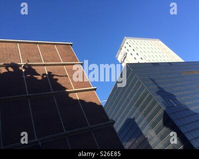 Shadows cast on buildings seen whilst walking away from the Elephant Gate near the Carlsberg Brewery in Copenhagen, Denmark. Stock Photo