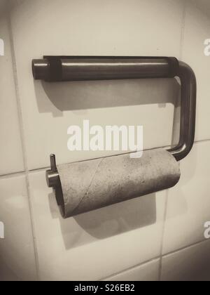 An empty toilet roll holder Stock Photo
