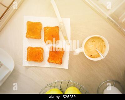 Morning breakfast with cappuccino and rusks with marmalade Stock Photo