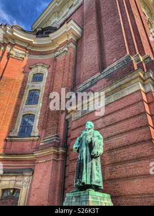 Statue of Martin Luther outside the Protestant Church, St. Michaelis in Hamburg, Germany. Stock Photo