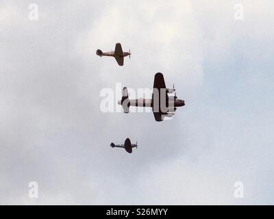 RAF Lancaster Bomber, Hurricane and Spitfire flying in formation. Stock Photo