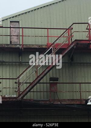 Metal stairs outside a steel works Stock Photo