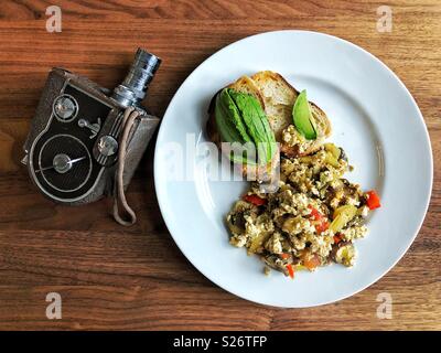Healthy vegan lunch and vintage movie camera Stock Photo