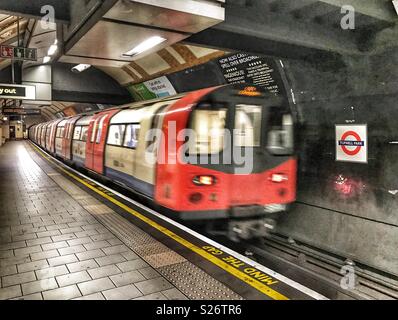 London Underground, Northern Line, tube train going through Tufnell Park Station, empty platform Stock Photo