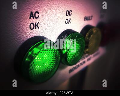 Control panel on uninterruptible power supply indicating that both AC and DC systems are running OK. Stock Photo
