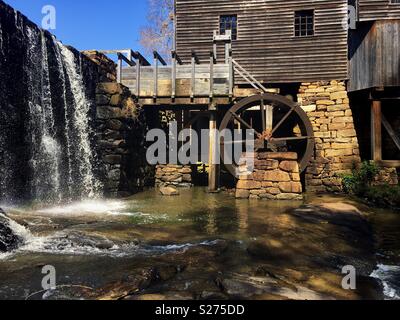 Waterwheel, flume, and waterfall at Historic Yates Mill County Park in Raleigh North Carolina. Stock Photo