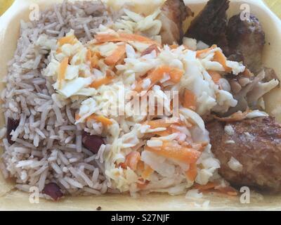 Jerk chicken rice peas and coleslaw Stock Photo