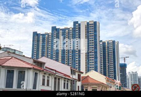 Singapore modern housing residential blocks behind row of old shop house - fusion/ contrast concept