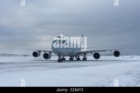 Cathay Pacific Boeing 747-800 arriving on the bay in Anchorage, Alaska Stock Photo