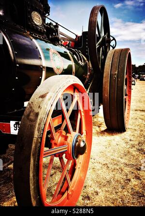 Black steam tractor with red wheels Stock Photo