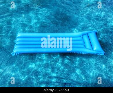 Blue kilo in blue swimming pool Stock Photo