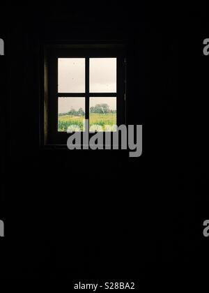 View of a field thru a barn window Stock Photo - Alamy