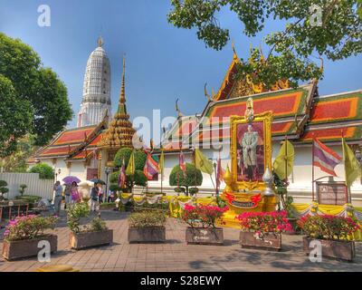 Tourists visiting a Buddhist temple in Bangkok, Thailand. Stock Photo