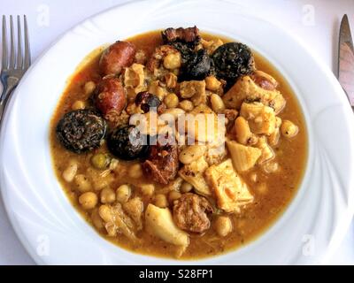 Callos or tripe with sausages and legumes. Spanish typical dish. Stock Photo