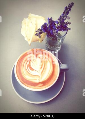 Lavender coffee cup. Latte art in cappuccino coffee cup at cafe table Stock  Photo - Alamy