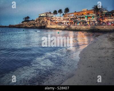 Beachfront bars and restaurants with crowds of people, on a summer evening Stock Photo