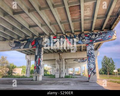 Graffiti art on concrete pillars of an underpass. Stock Photo