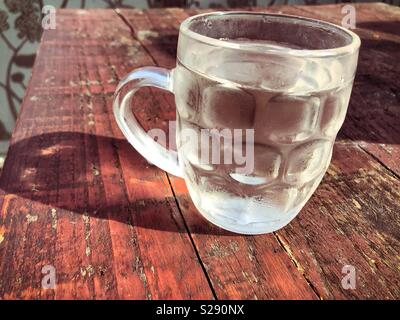 Cold half pint water of sunny day Stock Photo