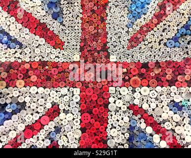 A British Union Jack flag made from buttons or pins in a patriotic background image with copy space Stock Photo
