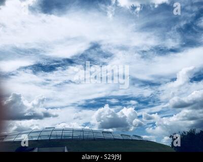 Clouds forming over some in botanical gardens wales uk Stock Photo