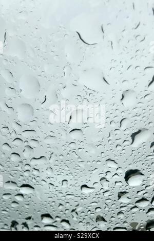 Water droplets on clear glass window Stock Photo