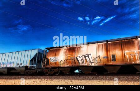 Rusty freight train rail car with graffiti Stock Photo