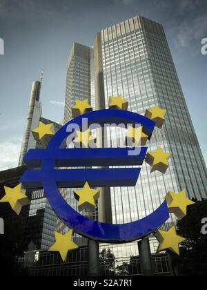 Germany, Frankfurt, Euro sign statue in front of skyskraper Stock Photo ...