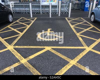 Disabled parking bay at the supermarket. Stock Photo