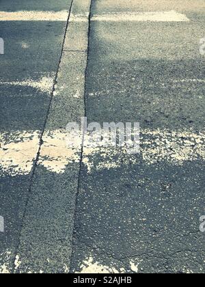 Old weathered zebra crossing Stock Photo