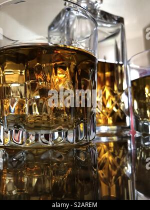 Glasses of whiskey on ice Stock Photo