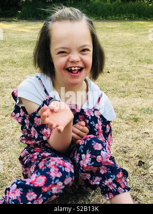 Beautiful girl with Down Syndrome Stock Photo - Alamy