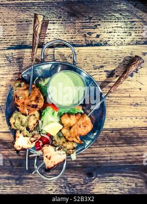 Chicken tikka on a skewer in an Indian restaurant Stock Photo