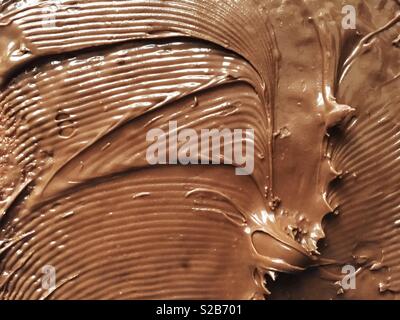 Chocolate cream spread on a slice of bread Stock Photo