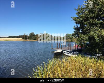 View of the lake in the grounds of Holkham Hall, Norfolk . Stock Photo