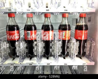 Coke bottle in a vending machine. Stock Photo