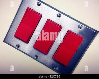 Commercial light switch with three rockers on/off switches, USA Stock Photo