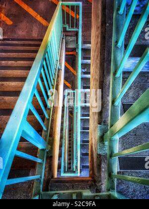 Looking down industrial staircase in parking garage Stock Photo