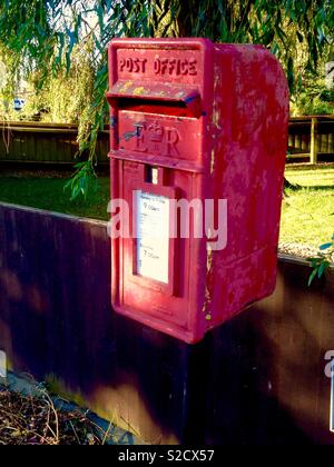 Faded countryside public post box in Lincolnshire, England Stock Photo
