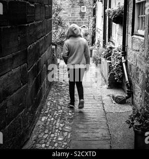 Exploring the back streets of Robin Hoods Bay. Stock Photo