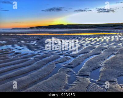 Patterns in the sand , early morning on Harlyn Bay, North Cornwall, England, late October. Stock Photo