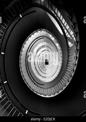 Looking up at spiral staircase Stock Photo