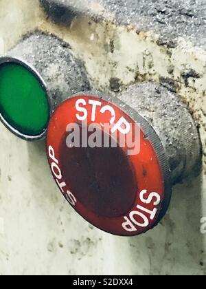 Emergency stop button on an industrial machine Stock Photo